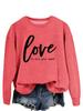 Suéter casual sencillo de manga larga para mujer de Amazon Independent Station con el mensaje "Love is all you need wish"