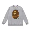 Marca moderna de estilo japonês com estampa de desenho animado de cabeça de macaco, nova blusa de moletom casual de gola redonda em terry de corte solto para homens e mulheres, adequada para adolescentes no outono e inverno
