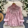 Blusa de manga larga color rosa suave estilo francés con volantes en el cuello y puños para mujer, juvenil y elegante con un toque de alta gama, Otoño 2026