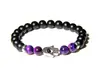 Pulsera Artesanal de Ónice Negro y Piedra Morada con Amuleto Hamsa Diseño Único y Elegante Cuentas de Alta Calidad Protección Espiritual Regalo Tamaño Ajustable para Hombres y Mujeres Accesorio de Moda Tendencia
