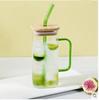Vaso cuadrado de vidrio con asa de color de fábrica Vaso para agua para el hogar Celebridad de Internet INS Vaso para agua con pajita Resistente a altas temperaturas Transparente