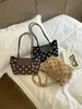 Bolso de axila de lunares de moda, nueva colección principios de otoño 2026, bolso tote casual y versátil, bolso de mano y bolso de hombro elegante y moderno