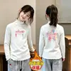 Blusa Térmica de Felpa para Niñas con Cuello Volante Otoño Invierno 2026 Nuevo Estilo para Niños Medianos y Mayores Cuello Alto Capa Base Cálida Blusa Casual