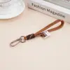 Nuevo Llavero de Dibujos Animados Colorido Cordón de Nailon Metal Bolso Muñeco Figura Colgante de Cuentas Mosquetón Tejido