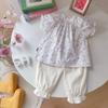Ropa de Verano para Niñas 2025 Nuevo Bebé Manga Corta Floral Lazo Moda Estilo Princesa Manga Abullonada Pantalones Medios Conjunto de Dos Piezas