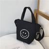 Bolsa Transversal Infantil 2025 Novo Estilo Coreano Lona Mini Bolsa Balde Rosto Sorridente Fofo Estampado Dupla Face Bolsa de Menina