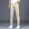 Pantalones casuales para hombre, nuevos pantalones tipo cigarrillo ajustados de negocios color caqui para primavera y otoño, pantalones largos elásticos para hombre, versátiles de largo nueve puntos