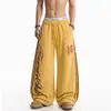 Pantalones de chándal casuales holgados de pierna ancha con estampado de leopardo, estampado de letras y rayas, estilo callejero americano de primavera y otoño, subcultura, para hombre