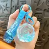 Llavero creativo de aceite de rosa lindo con arena movediza líquida pequeño colgante accesorios para bolso amantes pequeños regalos al por mayor