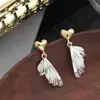 Brincos de Agulha de Prata 925 Cor de Contraste Dourado e Prateado Cauda de Peixe Amor Design de Nicho Luxo Leve Avançado Retro Brincos Elegantes