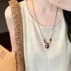 Colar com pingente de borboleta de madeira com contas vintage, um acessório étnico único e estiloso para mulheres, uma corrente longa e versátil perfeita para combinar com suéteres