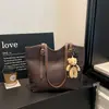 Bolsa de palha trançada estilo simples para mulheres, nova coleção 2026, bolsa de ombro de grande capacidade, bolsa de mão elegante e versátil