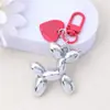 Estilo Ins Perro Globo Color Caramelo Colgante Llavero Metal Amor Estuche para Auriculares Colgante de Bolso Accesorios para Pareja