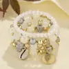Conjunto de 4 Pulseiras Estilo Férias na Praia, Pulseiras Elásticas Multicamadas com Conchas, Joias Coloridas de Contas, Presentes Criativos