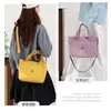 Bolsa de Tecido de Nylon Transfronteiriça Nova Bolsa de Mão Feminina Multifuncional Portátil Grande Capacidade Versátil Casual Bolsa de Ombro Atacado