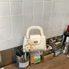 Bolso de mano de moda con cierre de hebilla de patrón de diamante para mujer, nuevo modelo 2026 bolso de hombro con cadena, bolso cruzado simple y elegante de nicho