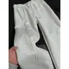 Pantalones deportivos blancos grises cleanfit de dobladillo curvo para hombre, primavera y otoño, estilo americano, pantalones con corte angular, pantalones ajustados rectos microacampanados