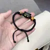 Libro Rojo mismo estilo lindo brazalete de gatito negro para hombres y mujeres pareja cuerda trenzada diseño nicho regalo para novias