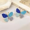 Aretes de isla hechos a mano de girasol de rafia y pasto, aretes de flores grandes exagerados de personalidad junto al mar, venta al por mayor de aretes