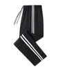 Pantalones de uniforme escolar de verano para exportación, unisex, adecuados para estudiantes de secundaria y preparatoria, azul marino, transpirables, con dos franjas, estilo de pierna recta