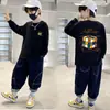 Camiseta de manga comprida lisa de algodão puro para meninos, camiseta básica para primavera e outono, nova blusa estampada estilosa e versátil estilo coreano para meninos