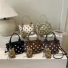 Moda fuente de fábrica transfronteriza 2026 nuevo diseño de lunares en nailon bolso de mano casual para el día a día bolso de hombro tipo cubo