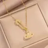 Broche Saturno con Diamantes Microincrustados de Moda Transfronteriza, Collar de Acero de Titanio para Mujer, Diseño de Lujo Ligero, Temática de Planetas al por Mayor, Sensación de Alta Gama