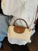 Bolso de Mano Pequeño Tejido Transfronterizo para Mujer Verano 2026 Nuevo Estilo Bolso de Hombro Único Cruzado Bolso Pequeño para Vacaciones en la Playa Bolso Tejido de Paja