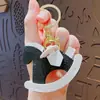 Llavero Creativo de Cuero de PU Caballo de Troya Colgante de Muñeca Lindo para Pareja Llavero de Coche Colgante de Bolso Pequeño Regalo