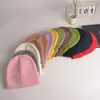 2022 nuevo gorro de punto con volantes de color liso para mujer, gorro de invierno de otoño e invierno, gorro de lana cálido de comercio exterior, combina con todo