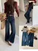 TOP de Outono estilo Europeu Guangzhou Treze Linhas versão Coreana jeans flare de quatro vias com barra desfiada e cinto 3132