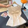Colete de malha com laço tridimensional, estilo doce, solto e suave, para mulheres, novidade de outono 2026, colete de suéter sem mangas em camadas