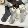 Calcetines de moda para otoño e invierno, calcetines lindos de gato para mujer, calcetines de estilo japonés ins de moda de terciopelo sintético hasta la pantorrilla, calcetines de dibujos animados de Zhuji