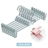 Almacenamiento para uso doméstico clips de plástico para pantalones sin marcas clips para faldas jk perchero multifuncional para pantalones clips para pantalones retráctiles colgador de pantalones de apilamiento multicapa
