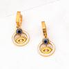 Juego de joyería exagerada europea y americana redondo ojos de diamantes completos collar con colgante de doble clavícula pulsera de acero de titanio aretes venta al por mayor