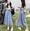 Saia Jeans Elástica de Cintura Alta Feminina Primavera e Verão 2025 Nova Média Cobrindo o Quadril Saia Pequena de Quadril em Formato A
