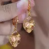 2025 Nuevos Pendientes de Corazón de Ojo de Gato Dorado de Gama Alta Lujo Accesible Moda Morado Completamente Diamantados Exquisitos Pendientes de Celebridad