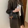 A bolsa tiracolo da moda deste ano para mulheres, bolsa Boston trançada, novo estilo 2026, adequada para trabalho e deslocamento, bolsa de mão feminina
