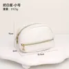 Bolsa de cosméticos nueva de cuero PU transfronteriza, bolsa de almacenamiento portátil de viaje para mujer con bolsillos incorporados, set de regalo y neceser, personalizable