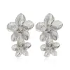 Europa y Estados Unidos venta caliente transfronteriza exagerados de moda aleación flor flor clip para oreja aretes largos plata flor joyería para oreja