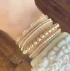 Pulsera de Cadena Redonda con Perlas Cruzada Europea y Americana Creativa Retro Personalizada Pulsera Elástica de Perlas Accesorios de Principios de Primavera para Mujer Set de 6 Piezas