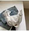 Bolso de Mano para Mujer Diseño de Nicho Estilo Coreano Bolso de Empanada 2026 Nuevo Gran Capacidad Casual Bolso Cruzado de Lona Ligero y Moderno