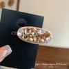 Clipe de Cabelo Oval com Strass Pérola Cor Champanhe Novo Primavera/Verão 2026 Estilo Elegante para Franja Clip de Cabelo de Alta Qualidade