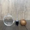 En stock: B003-25ml botella de perfume de vidrio transparente redonda plana de cristal, botella vacía con pulverizador de perfume redondo