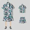Camisa floral de manga corta, Ropa de playa de Hainan, Estilo hawaiano de Sanya, Conjunto de pantalones cortos finos de verano para hombre y pareja de viaje a Tailandia