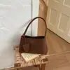 Bolso tejido de nicho estilo francés Ruien para mujer, nuevo bolso de hombro vintage de moda para commuting otoño 2026