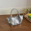 Bolso de Cubo Tejido de Alta Gama para Mujer 2026 Nuevo Estilo Coreano Bolso de Hombro Cruzado para el Trabajo Moda Elegante Bolso Plateado para Mujer