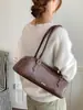 Nova bolsa de nicho estilo francês transfronteiriça para mulheres, bolsa baguette vintage de ombro, elegante para o trabalho e uso casual, bolsa de mão e bolsa de ombro versátil