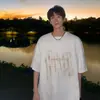 Camiseta de hiphop de calle alta estilo americano de manga corta para hombre, camiseta de algodón suelta de manga corta con estampado de letras de moda de verano para parejas