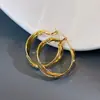 Pendientes de Aro Cruzados Lisos Dorados Esmerilados para Mujer, Lujo Accesible Elegante, Pendientes de Aro Populares, Pendientes, Pendientes de Estilo Metálico Otoño e Invierno